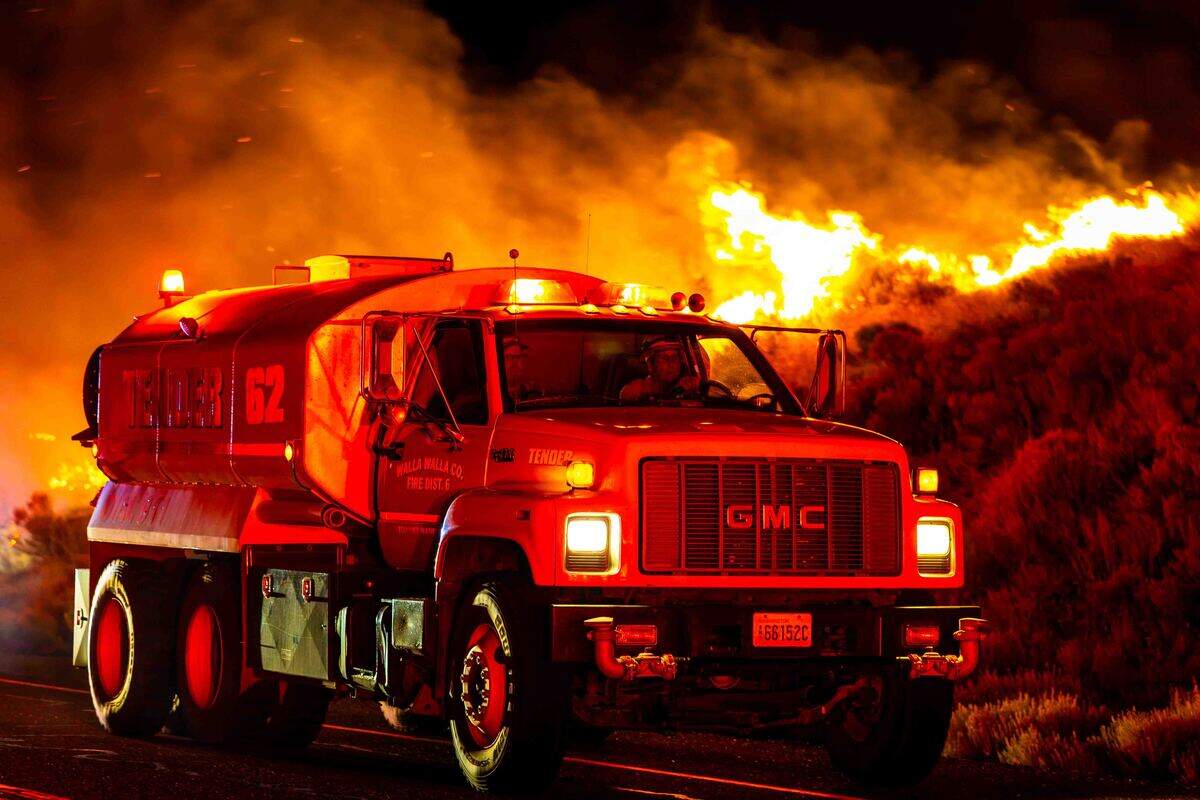 Support crews from Walla Walla County Fire District 6 responded along the fireline during the Nine Canyon Fire on Saturday morning near Kennewick. Wildland strike teams from around the region assisted local fire departments as crews battled the wind-driven wildfire.