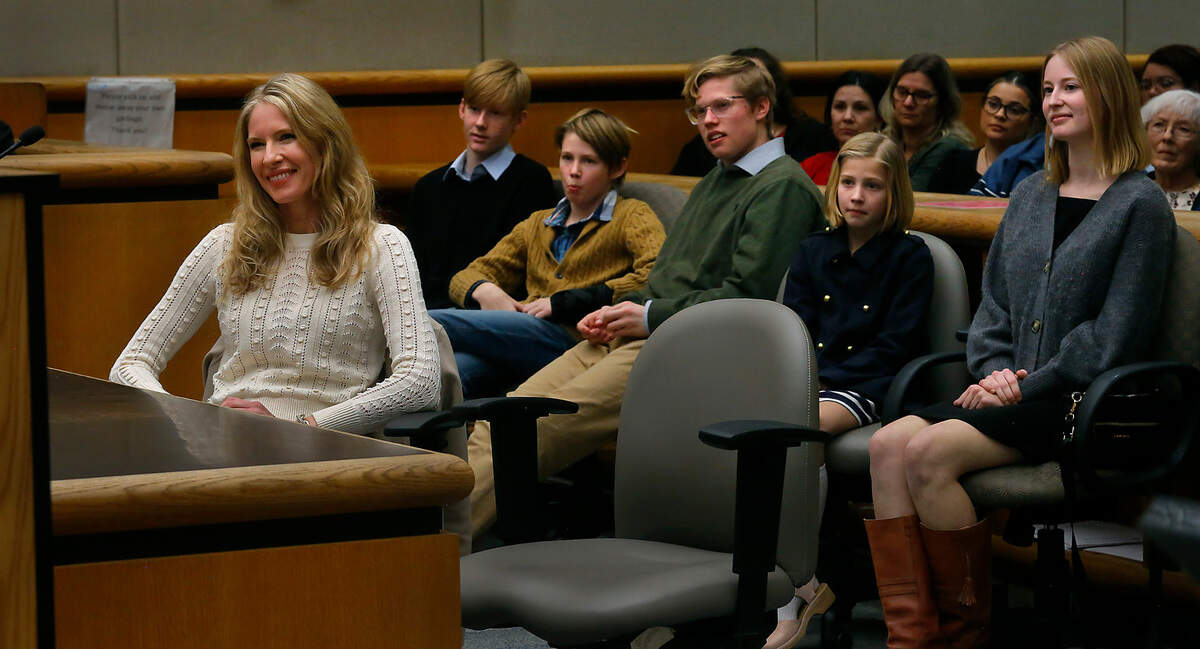 Eric Eisinger’s wife, Meghan, and their five children attend his swearing in ceremony as the new Benton County prosecutor, by Judge Diana Ruff at the Justice Center in Kennewick.