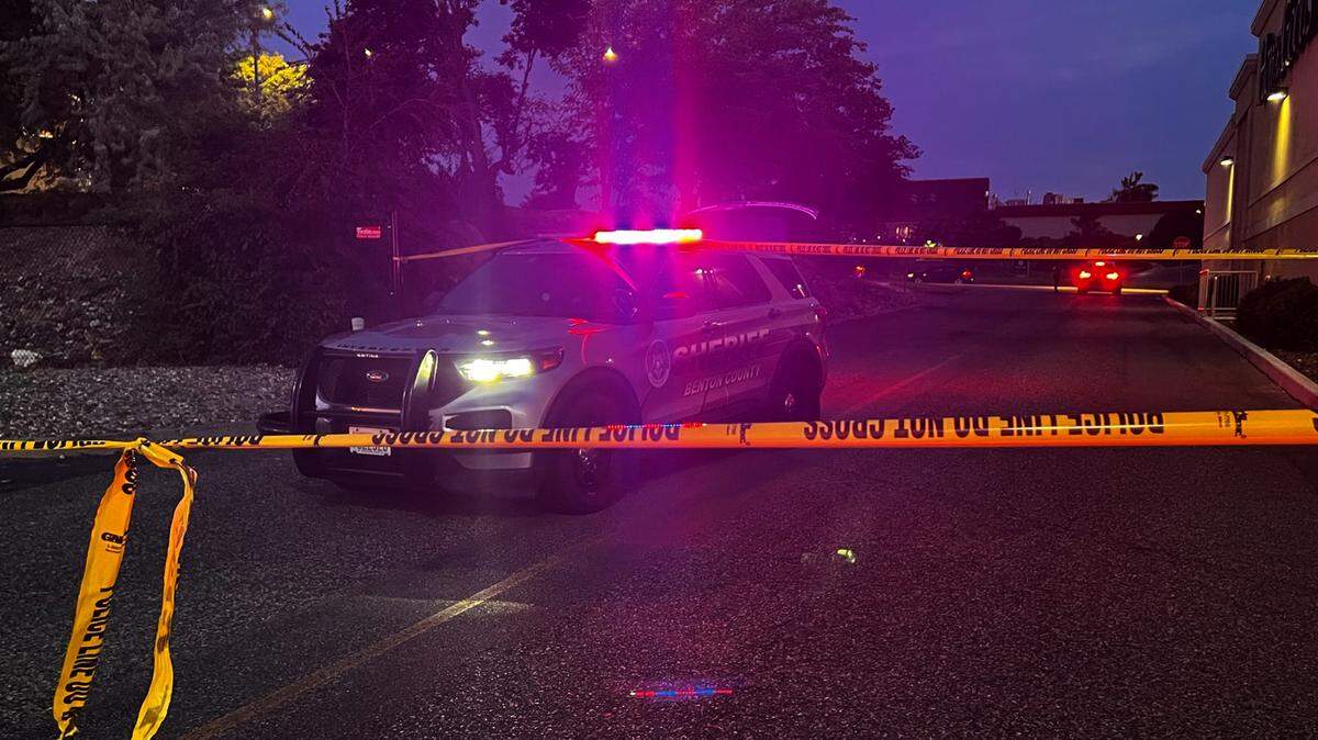 A Benton County Sheriff’s Office patrol vehicle is parked behind yellow police line tape near the HomeGoods store at 1321 Columbia Center Boulevard in Kennewick.