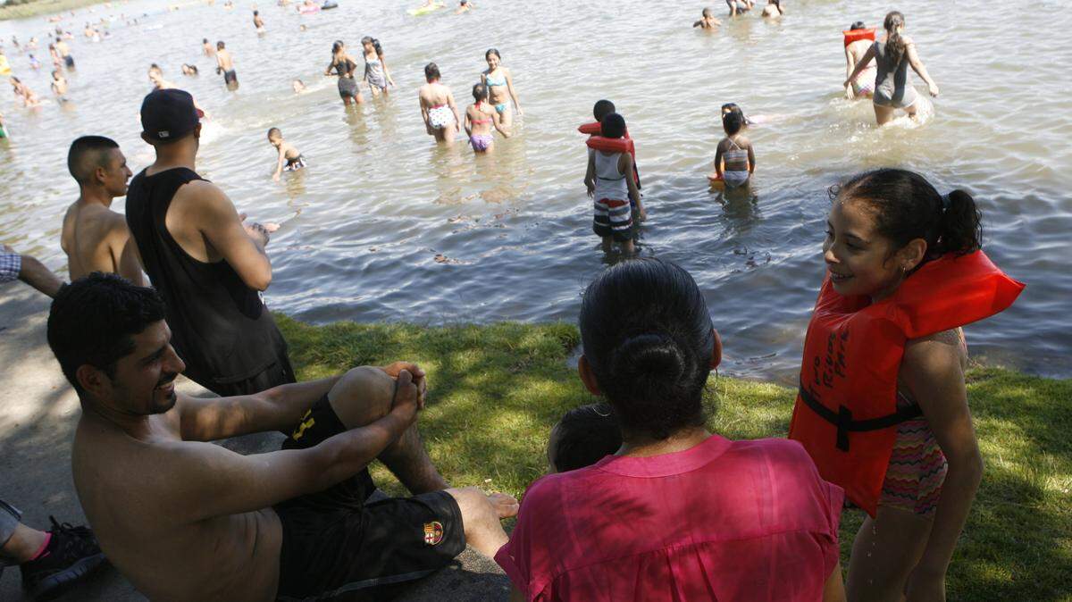 Mid-Columbia residents seek relief in the Columbia River as temperatures climbed into the 100s in the Tri-Cities.
