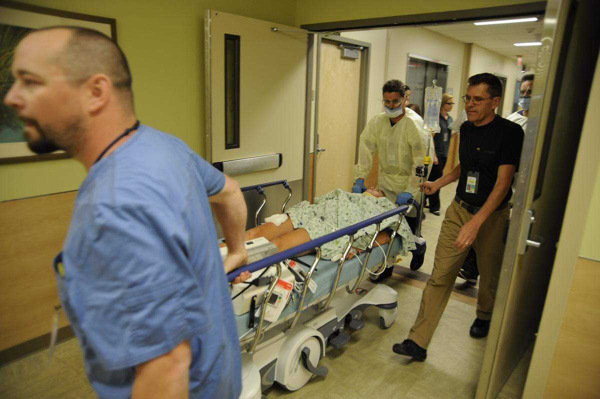 Staff in the emergency department at Trios Southridge Hospital complete a surprise trauma code drill in the ER in this 2014 file photo.