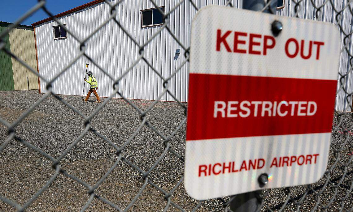 Mark Villa of Geophysical Survey in Kennewick maps out underground lines he marked with paint by using ground penetrating radar inside the fenced hangar area at the Port of Benton’s Richland Airport.