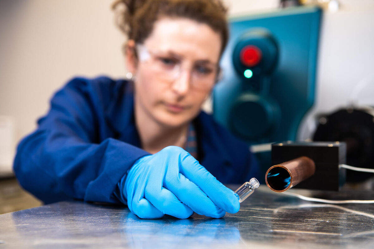 Chemist Elizabeth Denis demonstrates PNNL’s Vapor ID technology, which, when coupled with a mass spectrometer, can identify vapors of explosives and narcotics in the air, in real time, at levels previously undetectable by any other sampling technology.