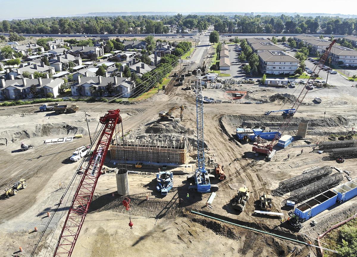 Construction crews work on the Duportail Bridge on the north side of the Yakima River in Richland. The estimated $38 million project will link Richland's waterfront, central business district and Queensgate areas. Watch a video at: tricityherald.com/video