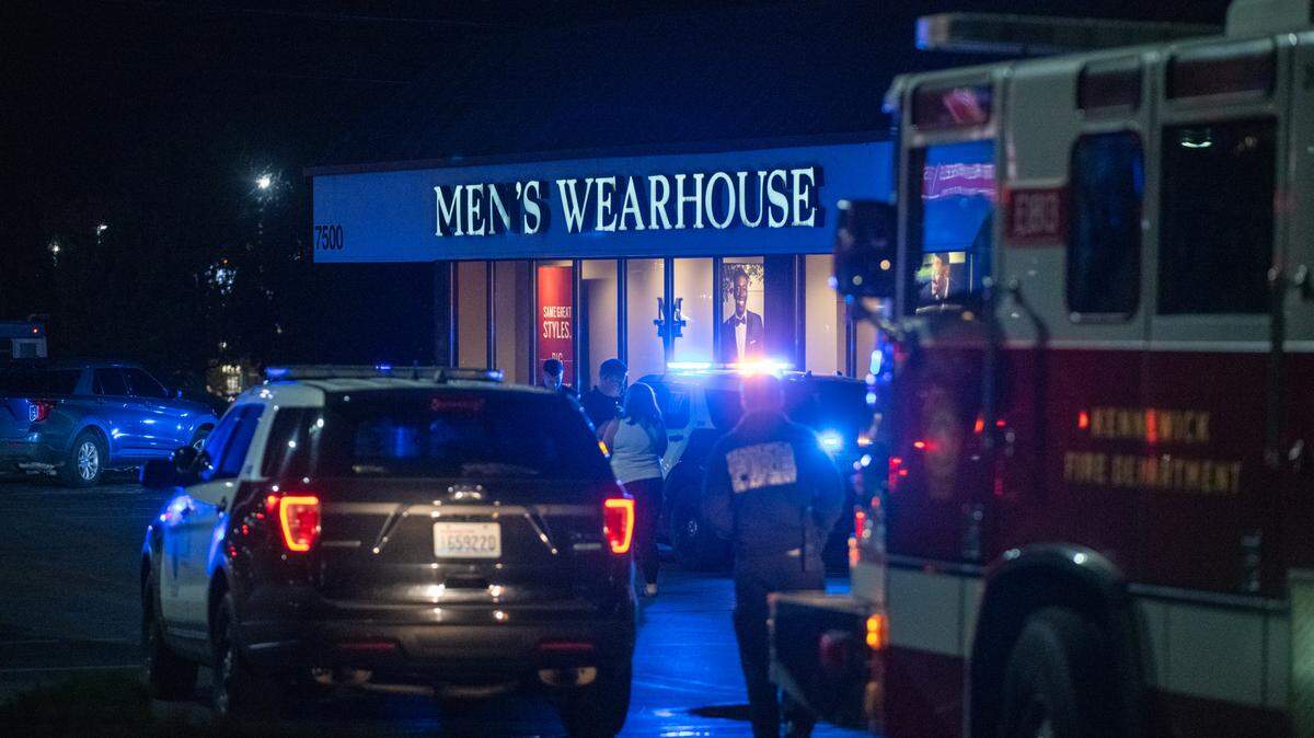A 14-year-old shooting victim is loaded into an ambulance in October 2022 near Men’s Warehouse on Columbia Center Boulevard in Kennewick. 