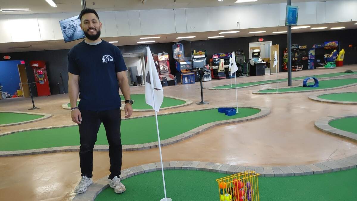 Reyes Gonzales poses at Tee Time, the Tri-Cities newest indoor mini golf facility. The 18-hole course is an all-ages destination and celebrates its grand opening with food trucks, face painting and more on Friday, May 3.