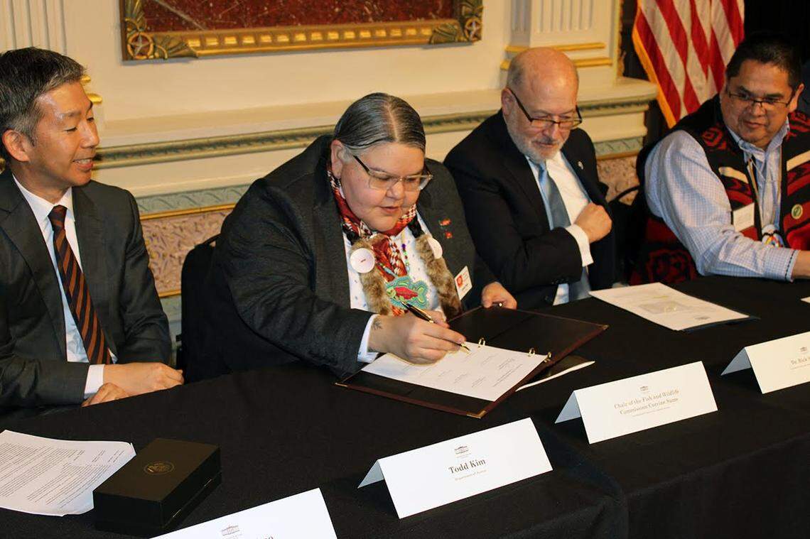Corinne Sams, of the Confederated Tribes of the Umatilla Indian Reservation and chairperson of Columbia River Inter-Tribal Fish Commission, signs an agreement between the Biden administration and the CTUIR, Nez Perce Tribe, Confederated Tribes of the Warm Springs Reservation, Yakama Nation and states of Oregon and Washington.