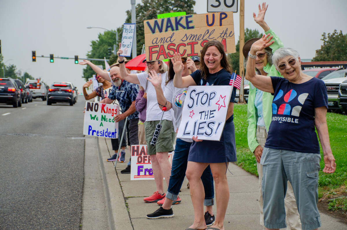 About 50 protesters rallied outside the Red Lion Hotel in Pasco where U.S. Rep. Dan Newhouse was speaking to about 300 at the Tri-City Regional Chamber of Commerce on Aug. 27.