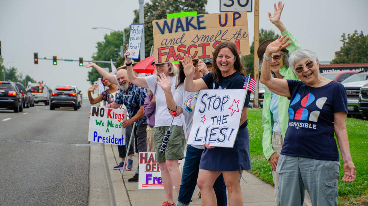 About 50 protesters rallied outside the Red Lion Hotel in Pasco where U.S. Rep. Dan Newhouse was speaking to about 300 at the Tri-City Regional Chamber of Commerce on Aug. 27.