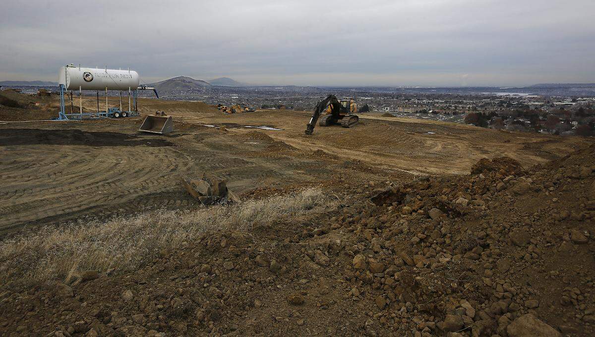 Outlines of new roads and residential lots are being scratched out of the dirt on the west end of the north face of Thompson Hill in Kennewick. 