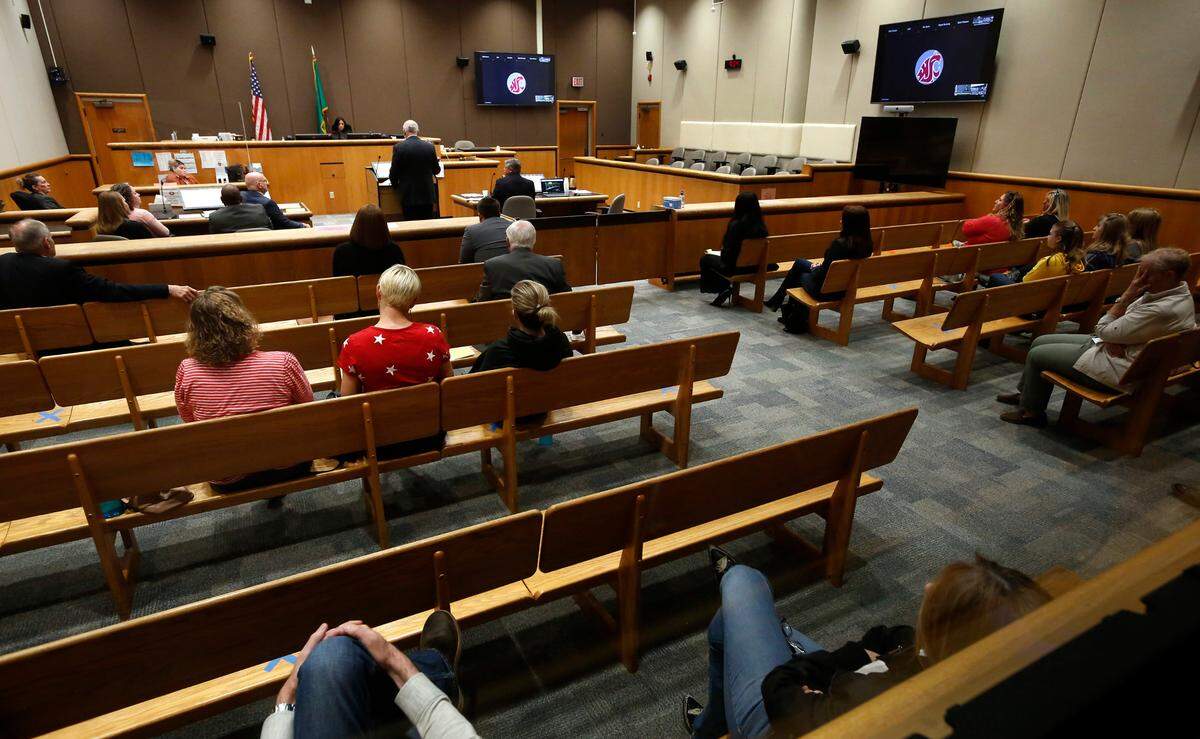 Judge Norma Rodriguez listens to opening arguments in Benton County Superior Court Monday morning in the recall peition of three Richland School Board members. Community members attended in person and also online.