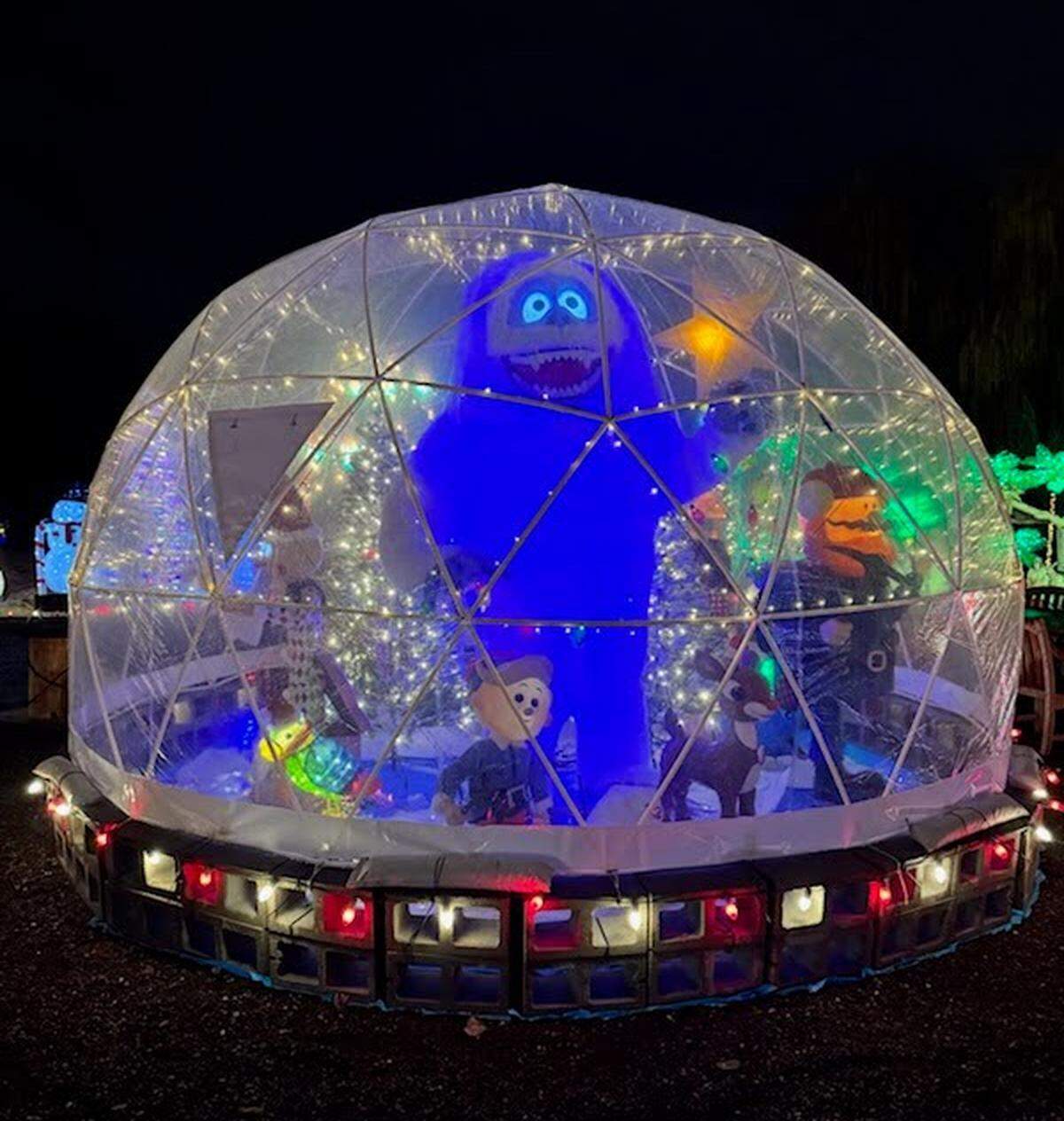 The Abominable Snowman stands inside an igloo as part of Christmas decorations at a Richland home.