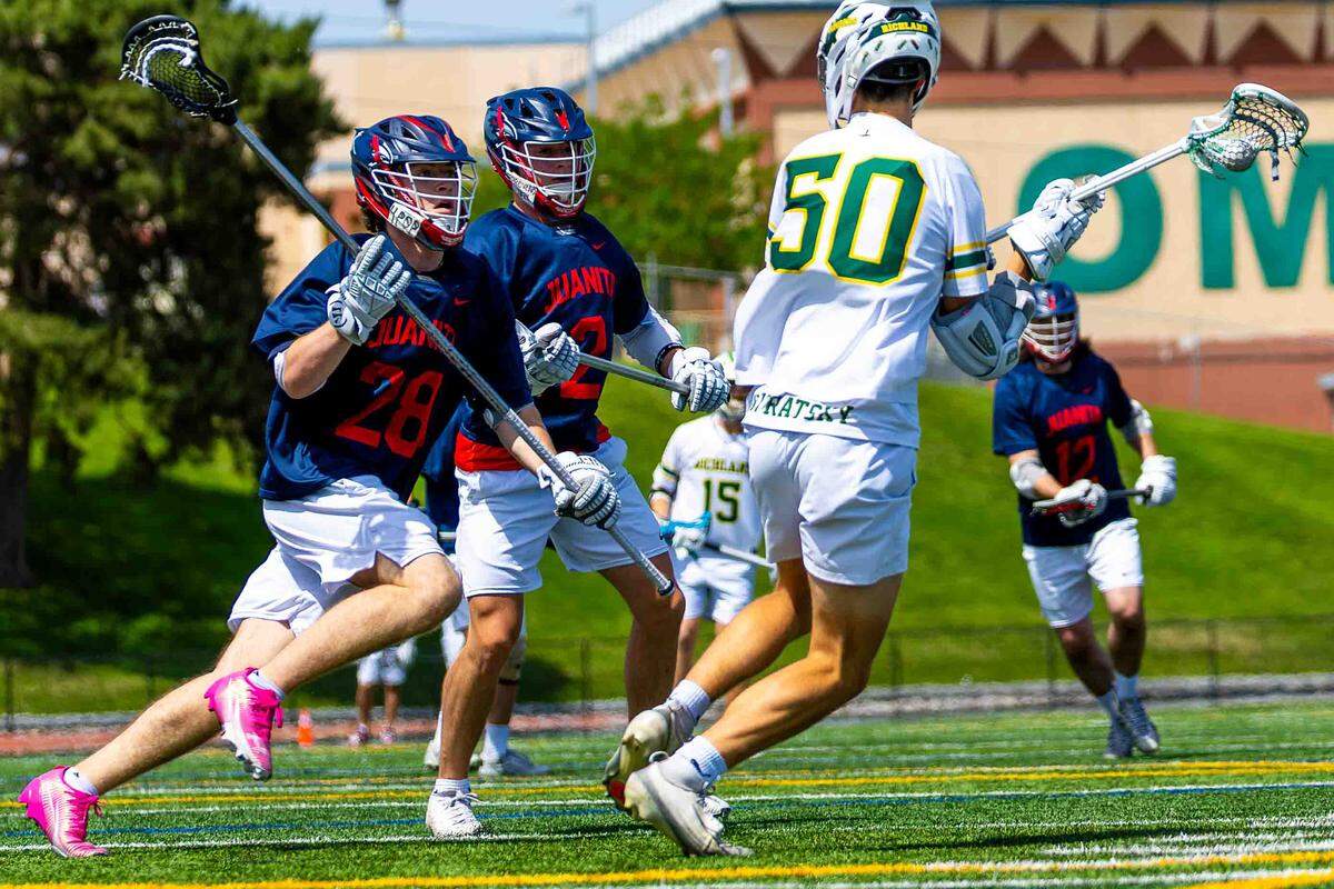 Richland sophomore Myles Privratsky (50) dodges between Juanita defenders during the Bombers’ 18-4 playoff win Saturday at Fran Rish Stadium in Richland.