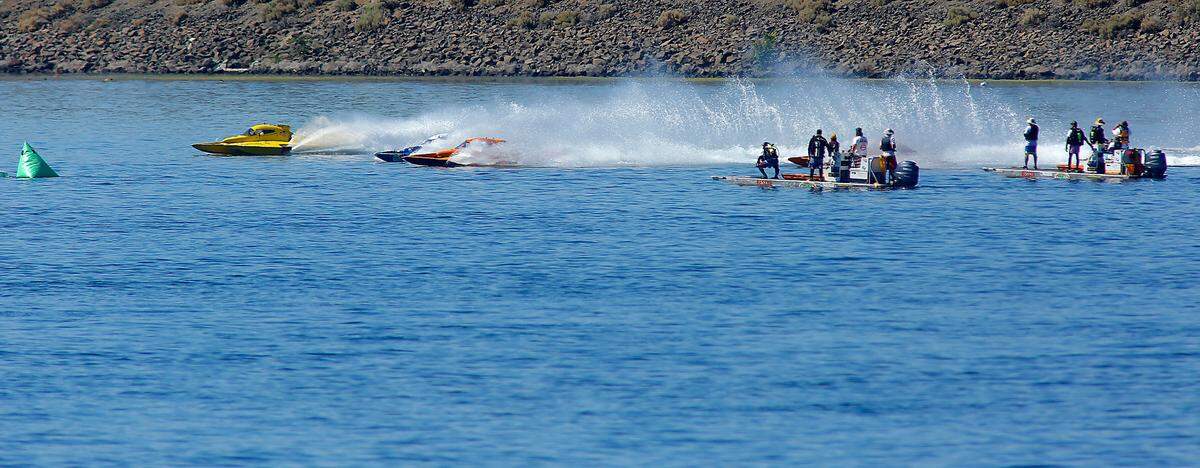 Kurt Myers, far left, in the E-1 racing boats leads the field past Water Follies rescue sleds at the start of the championship race for the E-350 class Sunday at the Columbia Cup. Myers won the three lap final race.
