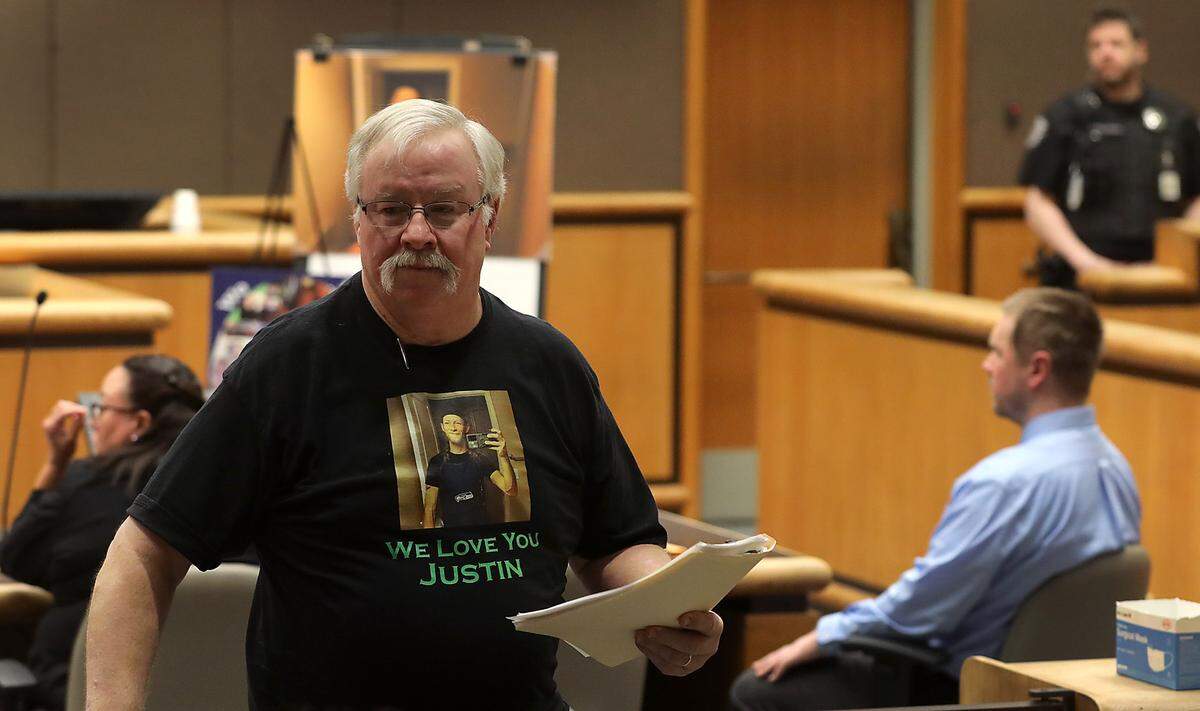 Ed Krumbah, father of murder victim Justin Krumbah, rejoins his family after speaking at Monday’s hearing for Richland Fred Meyer shooter Aaron Kelly. The family members asked the court to not find Kelly not guilty by reason of insanity for the February 7, 2022 crimes.