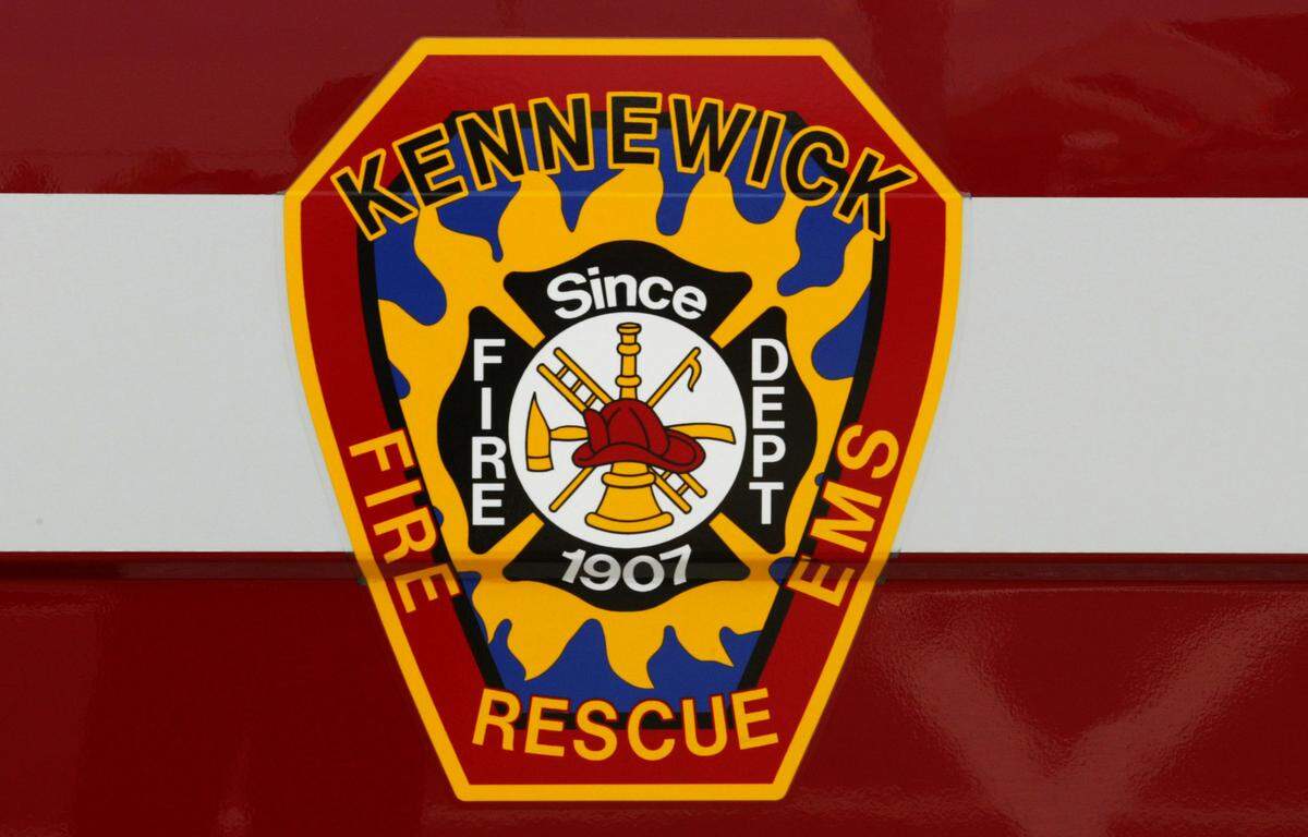 The seal of the Kennewick fire department on the side of one of the department’s ambulance.