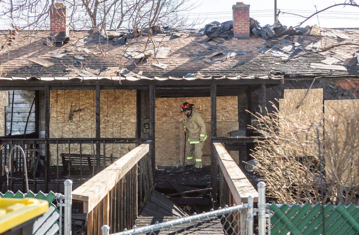 Assistant Fire Marshall Captain Ken Buechler investigates the origin of a house fire that gutted a Richland home at 1411 Stevens Drive on Monday night.