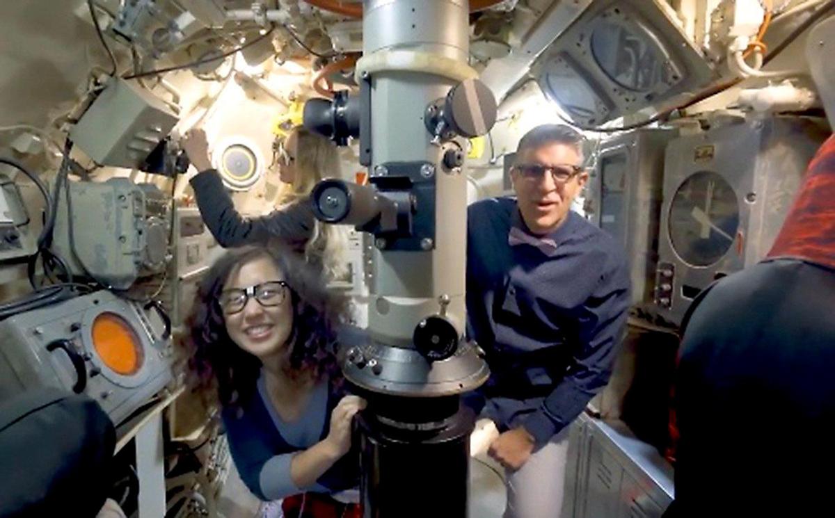 Michael Novakovich, Visit Tri-Cities president and CEO, and Bethany Lee, digital marketing manager, are featured in the agency's new video promoting science tourism, "Come On Get Your Geek On! Here they appear at the USS Triton Sail Park in Richland.