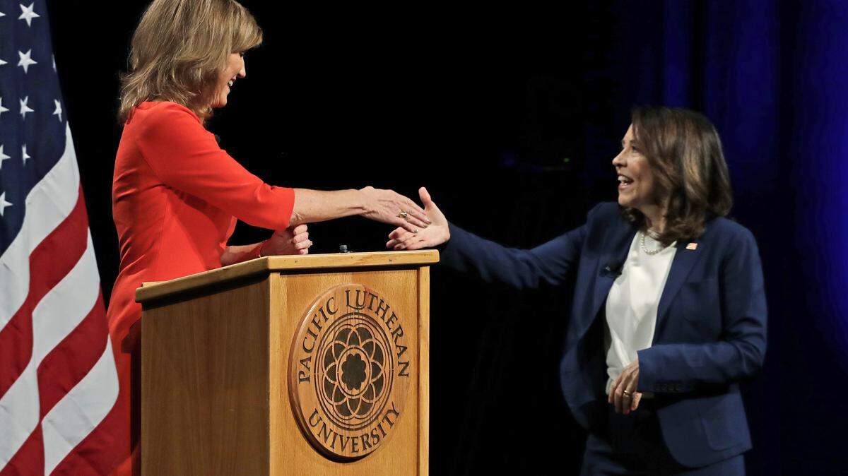 Sen. Maria Cantwell, D-Wash., right, shakes hands with her Republican challenger, Susan Hutchison, left, following a debate at Pacific Lutheran University in Tacoma, Wash.