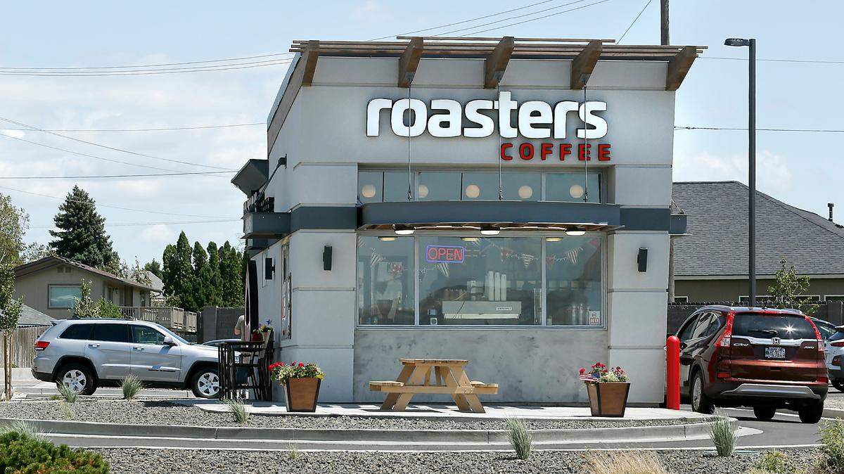 The Roasters Coffee shop on North Steptoe Street in west Kennewick serves a customer in the drive-thru lane.