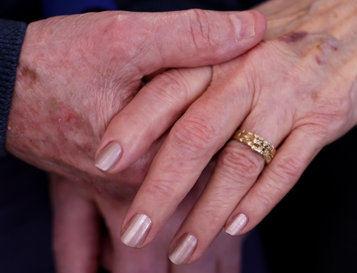 J. Sue Pope’s wedding ring rests on her hand as she and her husband, Nathan, hold hands at Brookdale Canyon Lakes in Kennewick ahead of Valentine’s Day. The Kennewick couple has been married 62 years after becoming engaged on Valentine’s Day 1964.