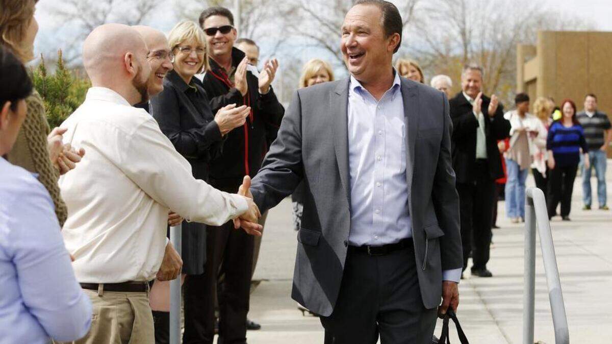 Former PNNL Director Mike Kluse shakes hands with staff at the lab in Richland.
