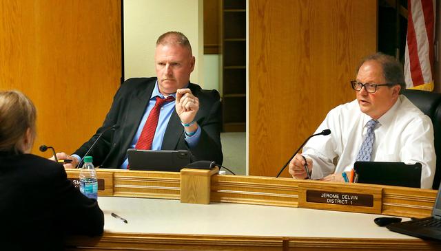 Benton County Commissioners Shon Small, left, and Jerome Delvin question interim county administrator Loretta Smith Kelty during their meeting in Prosser. The county commission voted 2-1 to assume control of the 700-plus bed jail. Watch a video at: tricityherald.com/videos