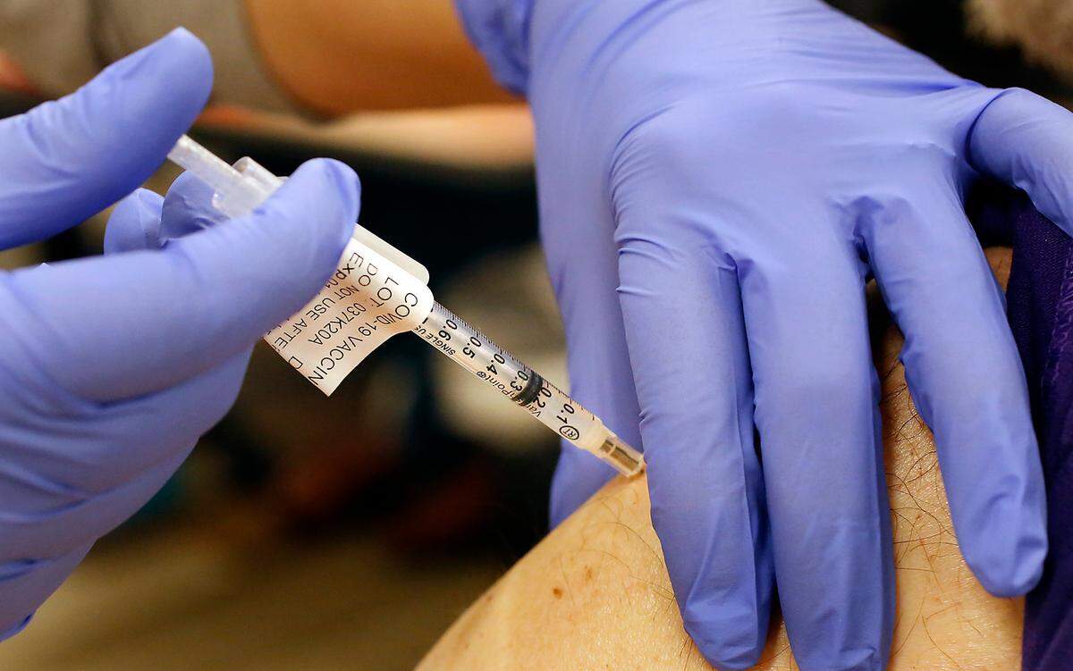 A Kadlec nurse administers a dose of vaccine at a COVID-19 community vaccination clinic held at the Kadlec Healthplex facility in Richland.