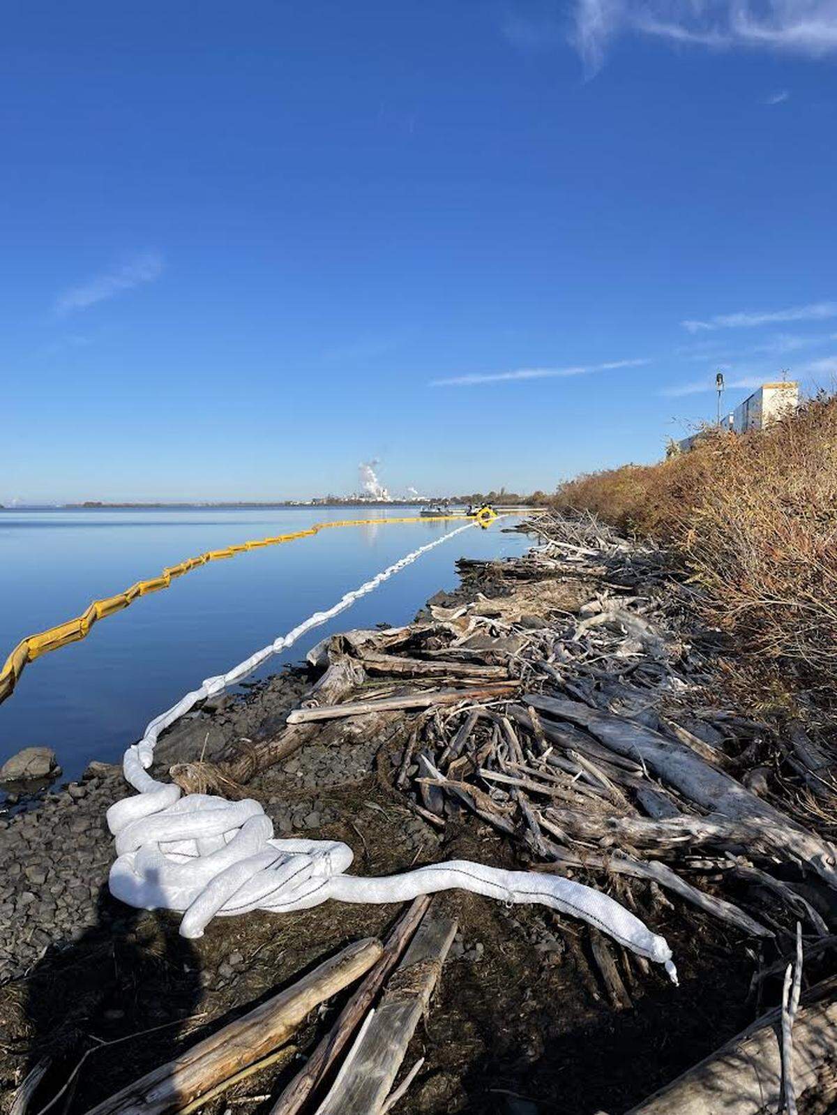 Booms were set out along eastern shoreline of the Columbia River near Wallula after a train derailment spilled diesel into the water early Wednesday morning.