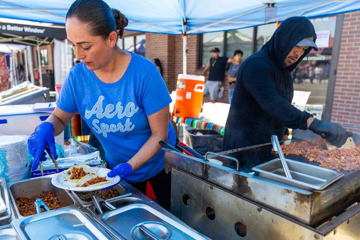 Food vendors prepare fresh tacos during Pasco’s Cinco de Mayo celebration on Saturday in downtown Pasco.