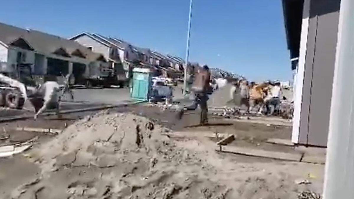 Pasco Police are investigating a brawl between a construction worker and neighbors across the street from the housing project. This video frame captures part of the confrontation that reportedly started over a parking dispute.