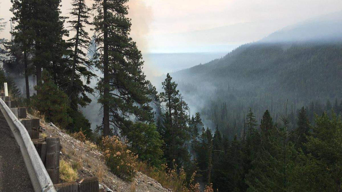 Smoke rises from the forest fire along Highway 12 near White Pass.