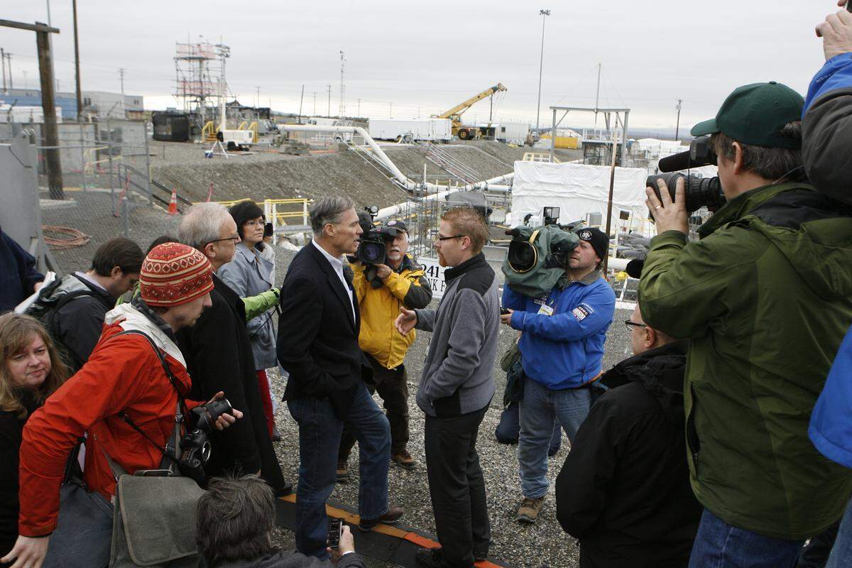 Washington Gov. Jay Inslee tours the Hanford tank farms in 2013 accompanied by Northwest news media. He opposes a federal plan that could reclassify some of the radioactive waste stored there.