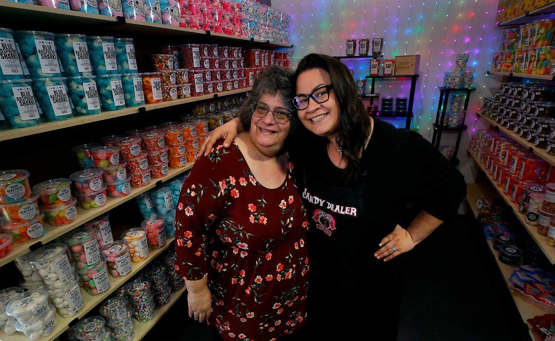 Sarra Hendrick, right, and her mom, JoJo’s namesake, JoJo Merrick, pause for a photo inside JoJo’s Freeze-Dried Goods manufacturing space and candy store in Pasco.