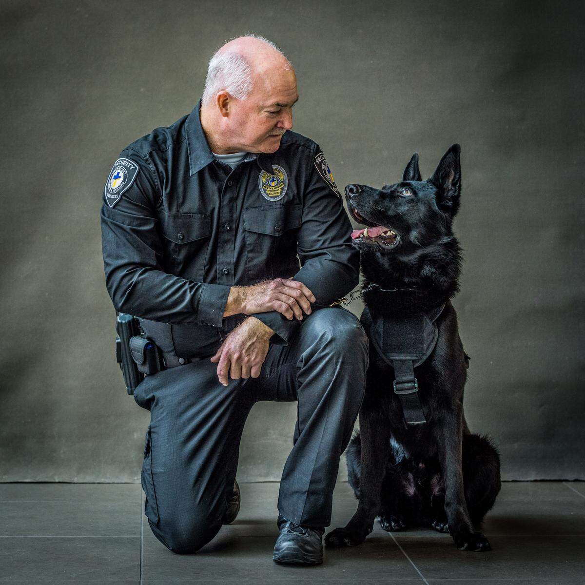 K9 Serge is pictured with handler Pat McKenna at Providence Sacred Heart Medical Center in Spokane. Kadlec Regional Medical Center is expanding its own security team at the Richland campus to include professionally trained canine security officers, including a German Shepherd.