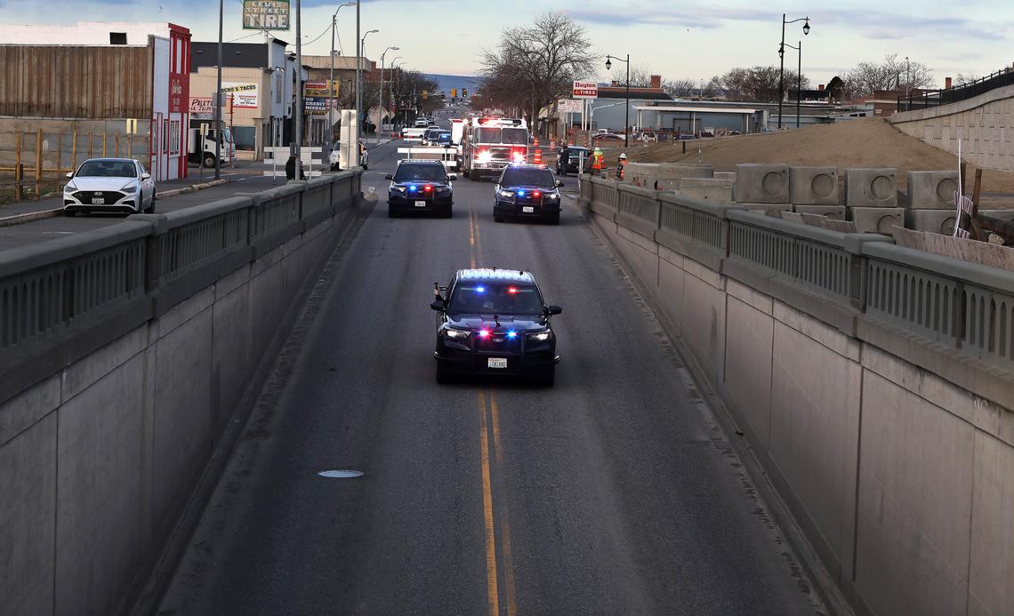 A small contingent of police and fire vehicles ceremoniously parade through Lewis Street underpass as the last vehicles to use the historic underground structure before its demolition. The nearly 90-year old structure is adjacent to the $36 million Lewis Street Overpass that is replacing the deteriorating structure. Traffic is being rerouted onto East A Street until the overpass opens in April.