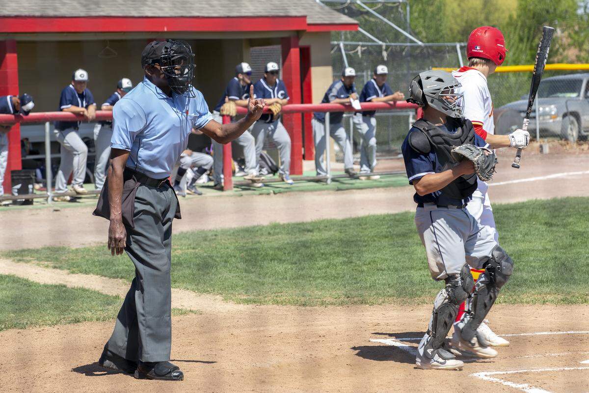 Greg Mitchell is the umpire at a high school baseball game at La Pierre Fields in Kennewick.