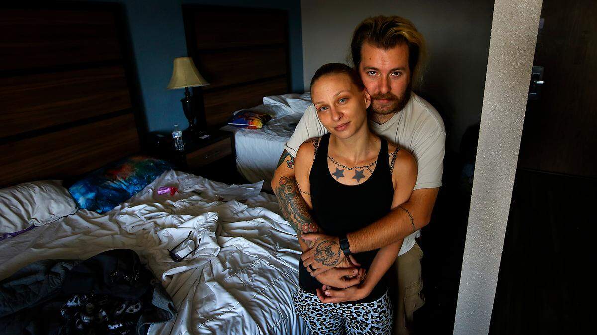 Becca and Danny Glasscock prepare to pack their belongings and check out of a Kennewick motel they were staying at when they ran out of money before the month ended.