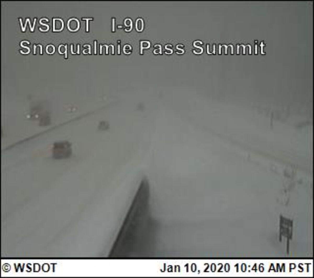 A traffic camera shows the Snoqualmie Pass summit at 10:46 a.m. Friday. More snow is expected through the weekend.