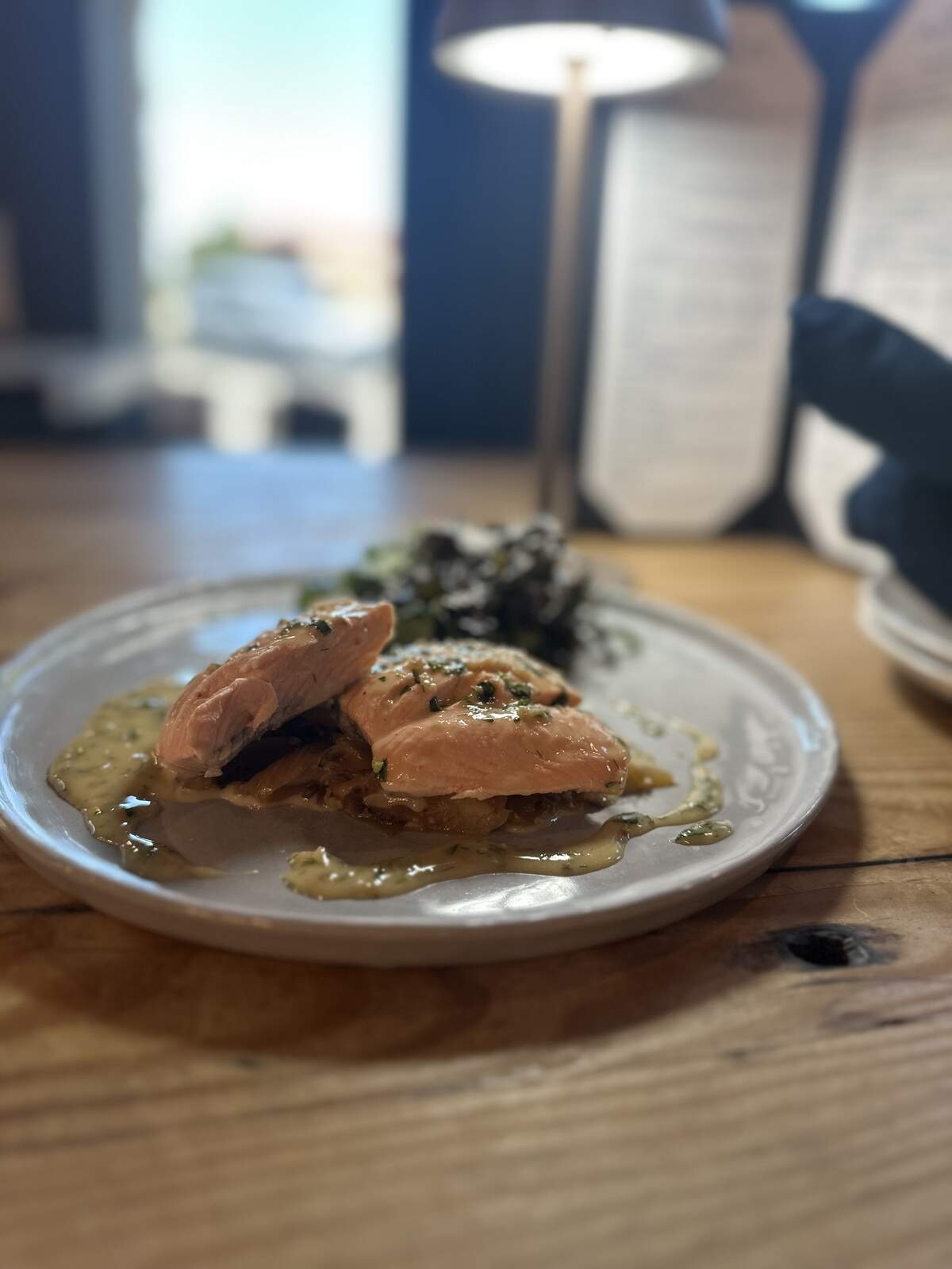 The menu also includes a Saumon Poché. This dish is a poached salmon with fingerling potatoes, fennel and a citrus salad, according to the menu.