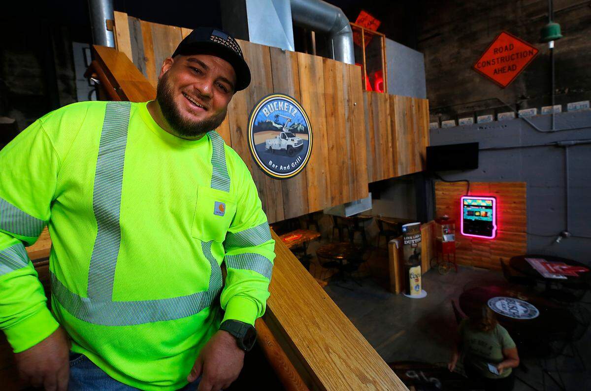 Co-owner Nate Fitzpatrick stands inside Bucketz Bar & Grill in the former home of Ice Harbor Brewery in downtown Kennewick. The utility-themed bar and grill opens Sept. 1.