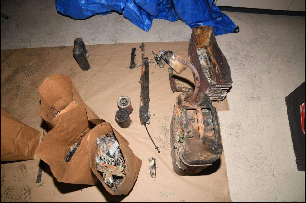 The remains of a shotgun, rifle as well as several pistol slides, a gas can and an ammunition box were found inside of Ryan Kaufman’s truck.