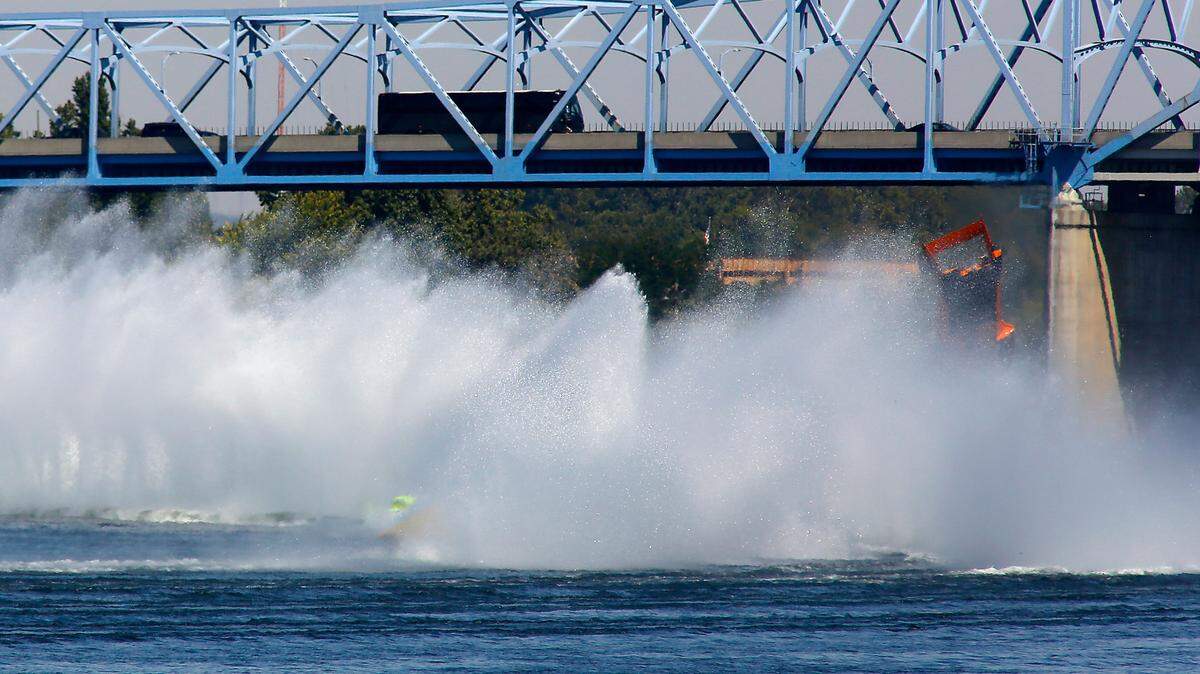 The U-40 Miss Beacon Plumbing unlimited hydroplane crashes near the blue bridge on the first lap of Heat 2 of the Columbia Cup race in Kennewick, WA.