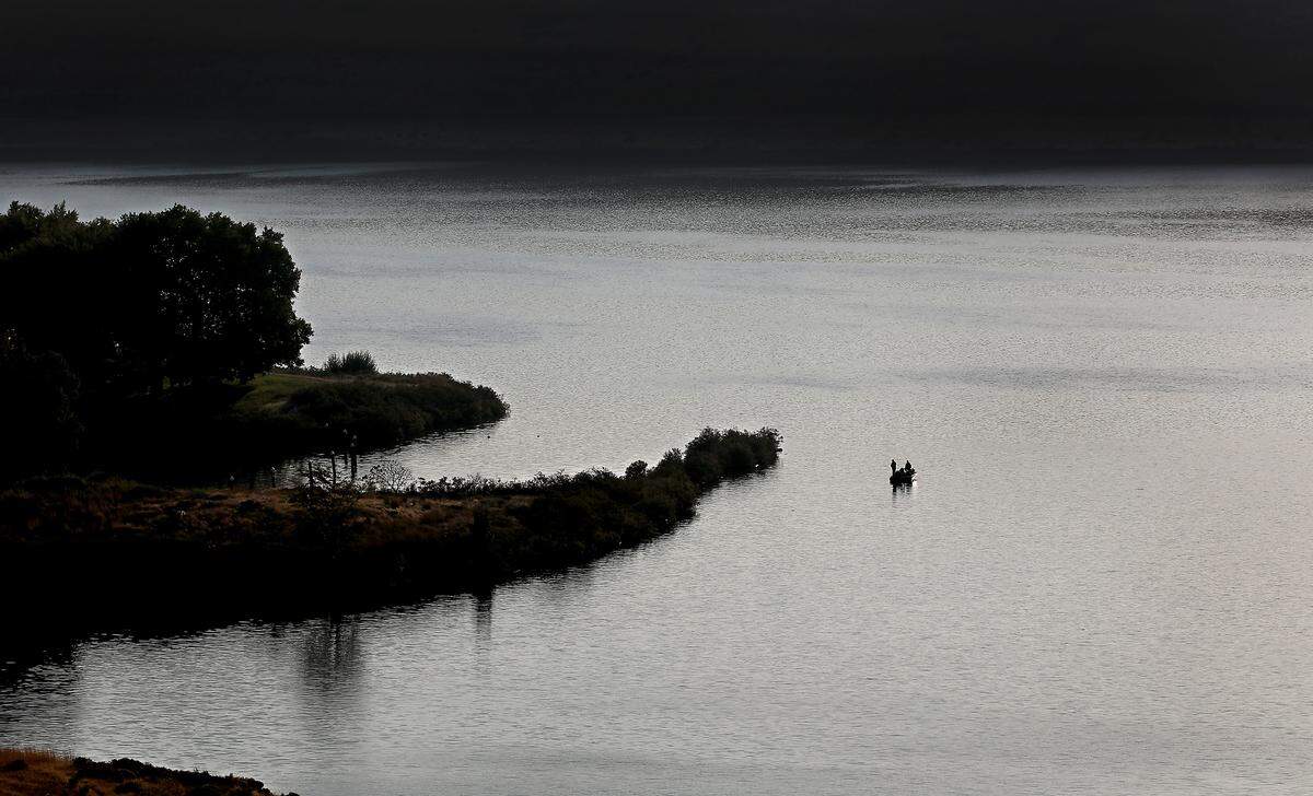 A lone boat with a pair of anglers tries their luck on the Snake River near Levey Park, the closed U.S. Army Corps of Engineers park located on the Snake River in rural Franklin County northeast of Pasco.