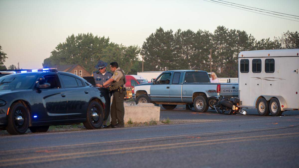 A Pasco woman died early Tuesday after the motorcycle she was on hit a pickup and trailer on Highway 397 in Finley.