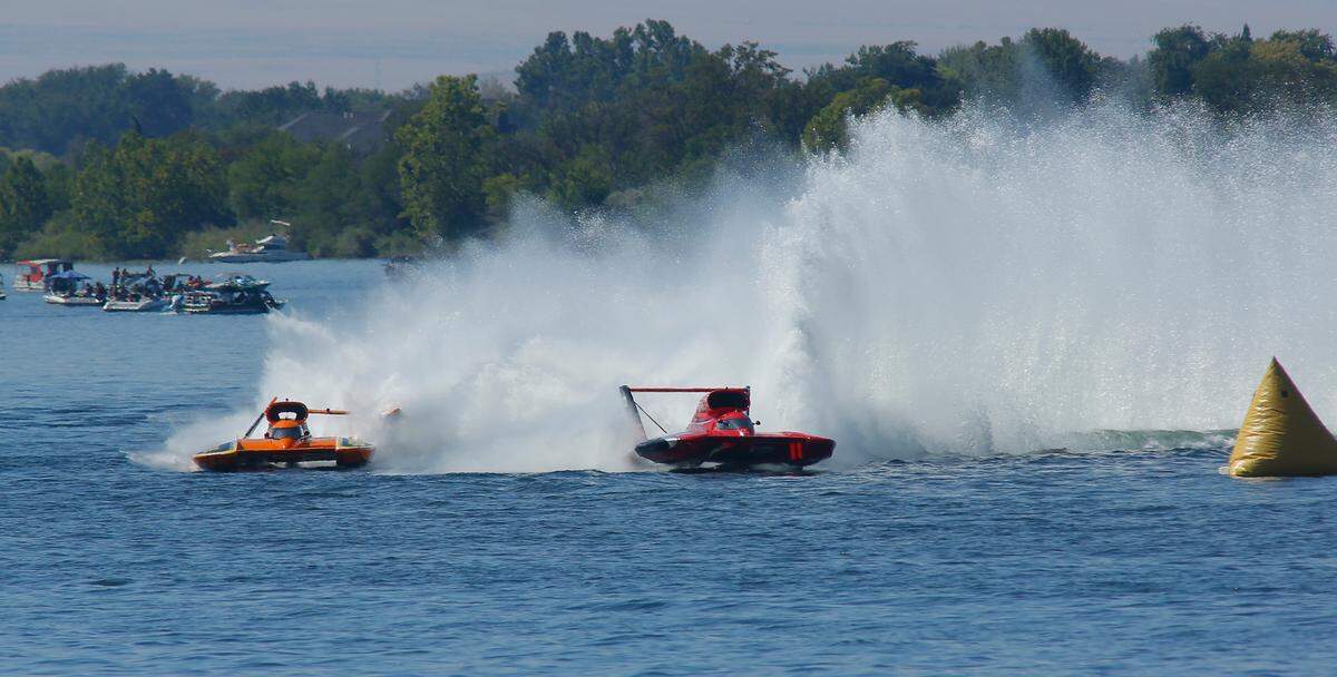 Andrew Tate in the U-12 Graham Trucking unlimited hydroplane races to victory as Dave Villwock follows in the damaged the U-40 Miss Beacon Plumbing during heat-1A of the Columbia Cup unlimited hydroplane race. Villwock’s apparent second place finish was later erased by race officials for a fuel violation.