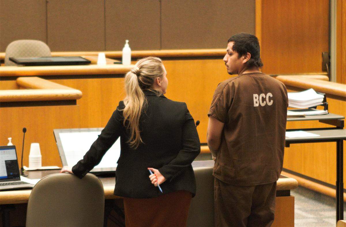 An attorney speaks to Ramon Candido during an initial court appearance in Benton Franklin Superior Court on Tuesday, April 26. Candido is accused of killing Ezekiel Sanchez in a gang-suspected shooting.
