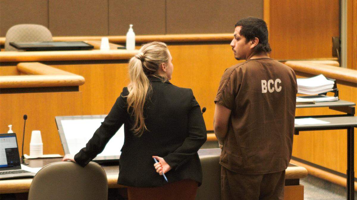 An attorney speaks to Ramon Candido during an initial court appearance in Benton Franklin Superior Court on Tuesday, April 26. Candido is accused of killing Ezekiel Sanchez in a gang-suspected shooting.