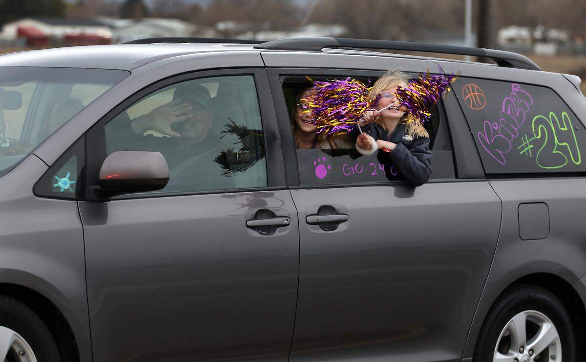 The parade procession included family members following in their own vehicles.