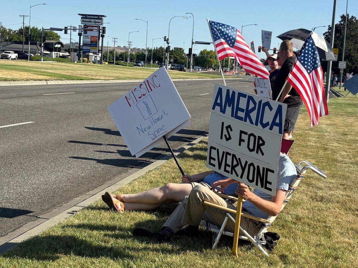 Several signs at the “Good Trouble Lives On” protest in Kennewick, Wash. on July 17 targeted Representative Dan Newhouse, criticizing his support of President Donald Trump.